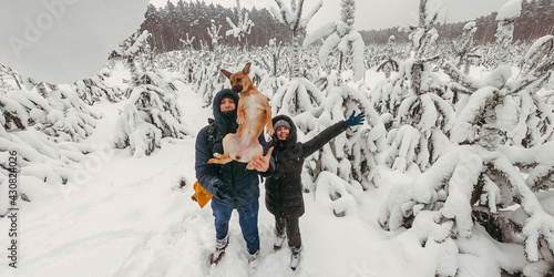 Selfie. A man and a woman take a souvenir selfie with a dog.