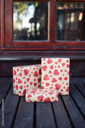 Rectangular gift box wrapped with heart paper