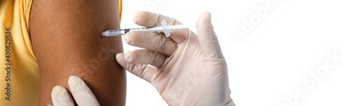 Cropped view of doctor in latex gloves doing injection with vaccine to african american man isolated on white, banner