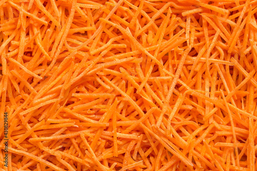 Grated carrots. Full frame of fresh organic shredded carrots