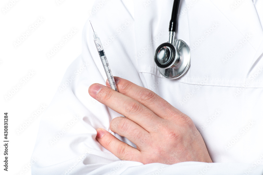 Cropped view of doctor with stethoscope holding syringe isolated on white Cropped view of doctor with stethoscope holding syringe isolated on white