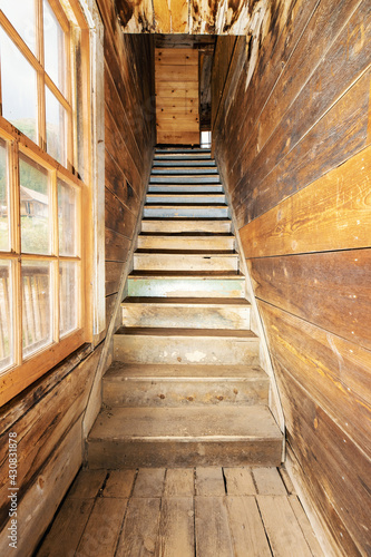 staircase inside abandoned home in colorado ghost town