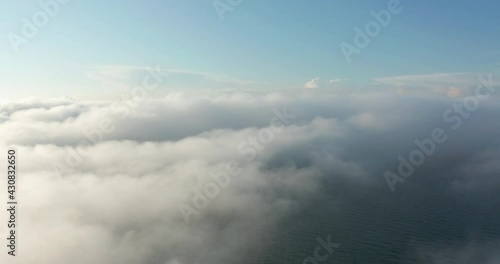 Wallpaper Mural Flying through amazingly beautiful cloudscape. Picturesque timelapse of white fluffy clouds moving softly on the clear blue sky. Direct view from the cockpit. Torontodigital.ca