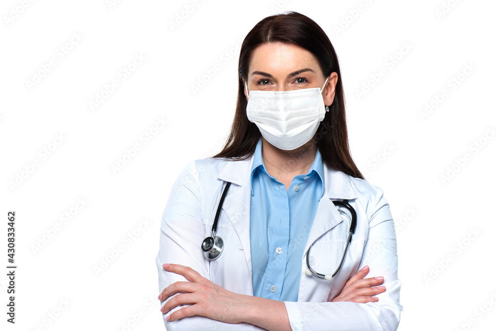 Doctor in medical mask with stethoscope looking at camera isolated on white Doctor in medical mask with stethoscope looking at camera isolated on white
