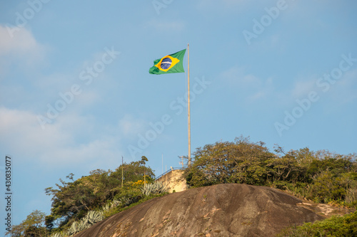 Brazil flag on top of the rudder stone in Rio de Janeiro.