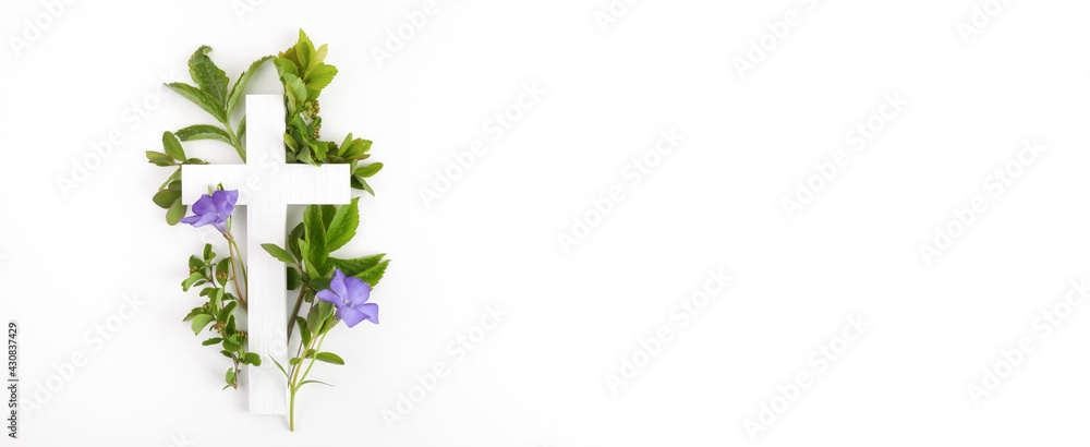 The Christianity cross of green leaves. Baptism, Easter, church holiday background The Christianity cross of green leaves. Baptism, Easter, church holiday background