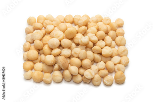 Macadamia nuts isolated on white background.