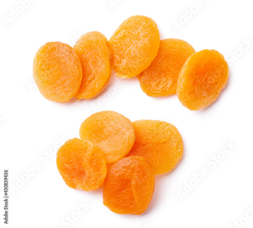 Group of yellow dried apricots isolated on white background