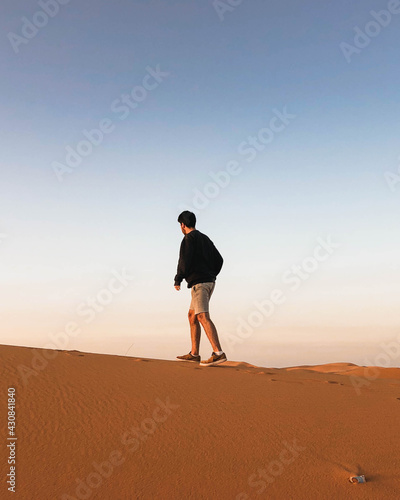 man walking on the Sahara desert