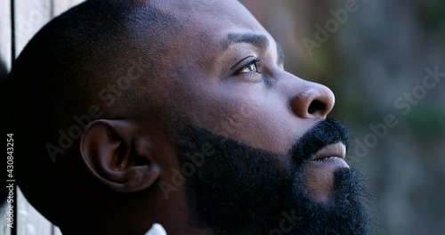 Worried black man close-up face. Anxious African guy