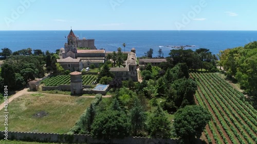 Wallpaper Mural Aerial view of the gardens the church and monastery of the Lerins abbey located at Ile Saint Honorat island is the second largest of the Lerins-islands near the French Riviera town of Cannes 4k Torontodigital.ca
