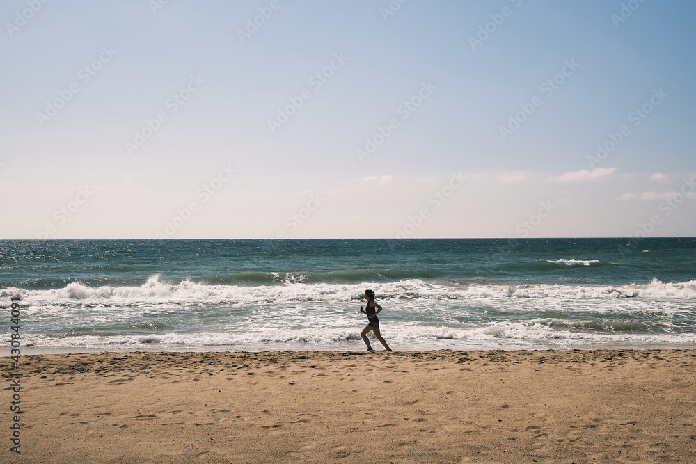 woman running on beach