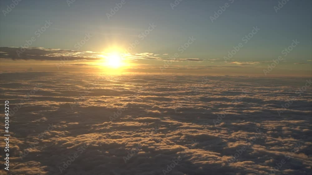 Beautiful sunset sky above clouds, dramatic light, view from airplane. Beautiful sunset sky above clouds, dramatic light, view from airplane.