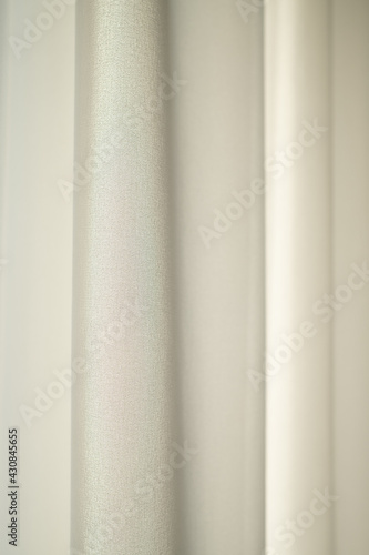 Tulle curtain. Sunlit curtain. Wavy fabric surface.