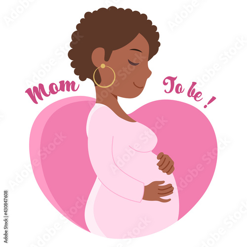 Beautiful black African pregnant woman holding her belly on heart shape background with Mom To Be text