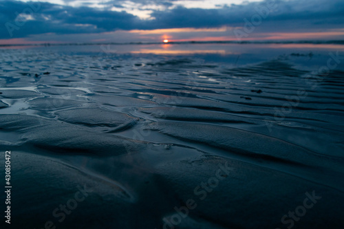 Beautiful sunset on the beach. Baltic sea. relief
