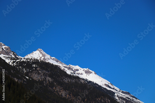 sunny austira snowy mountain hill landscape © Ampalyze