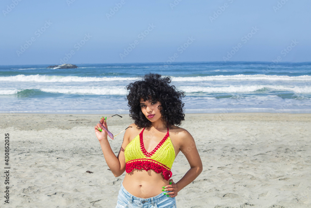 beautiful and sexy latina women enjoying her beach vacation with crochet  bikini. brazilian woman Stock Photo | Adobe Stock