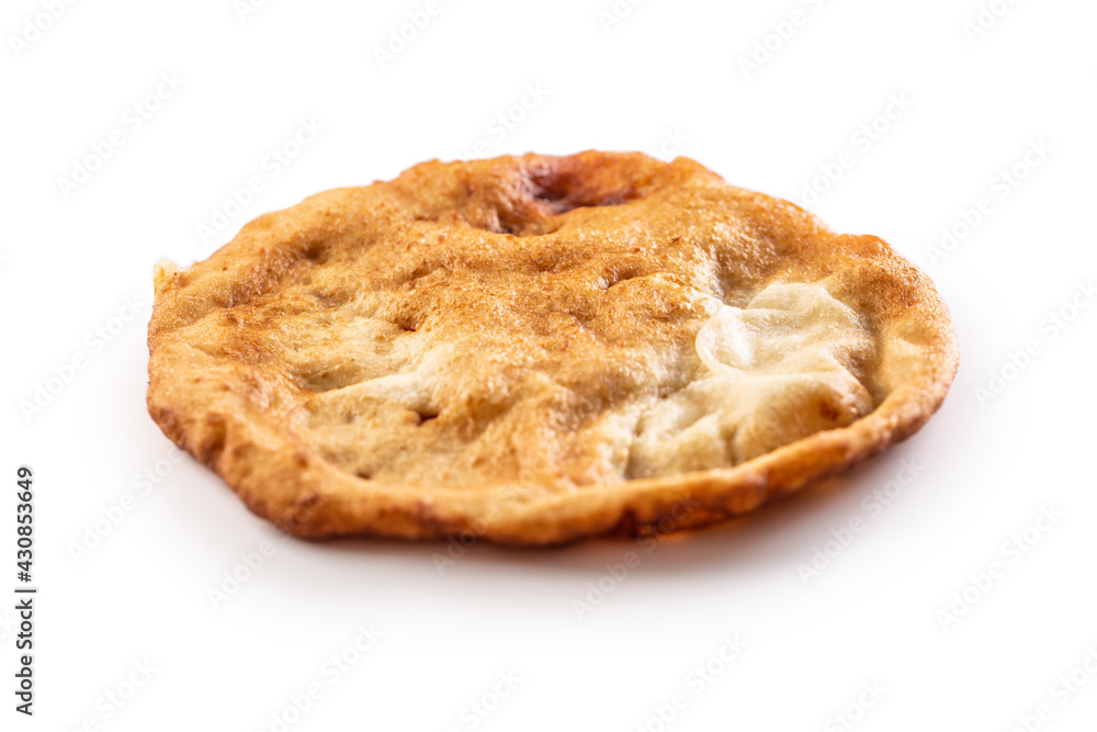 A single traditional delicious hungarian deep-fried langos in an isolated background A single traditional delicious hungarian deep-fried langos in an isolated background