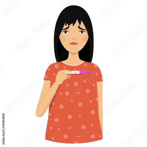 Sad young woman holding a negative pregnancy test.