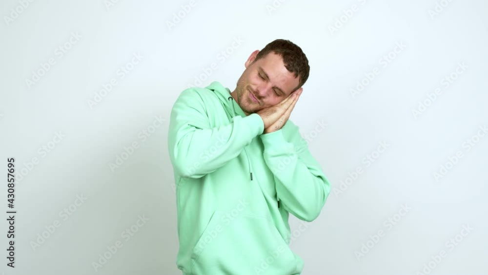 Brazilian handsome man making sleep gesture. Adorable and sweet expression over isolated background Brazilian handsome man making sleep gesture. Adorable and sweet expression over isolated background