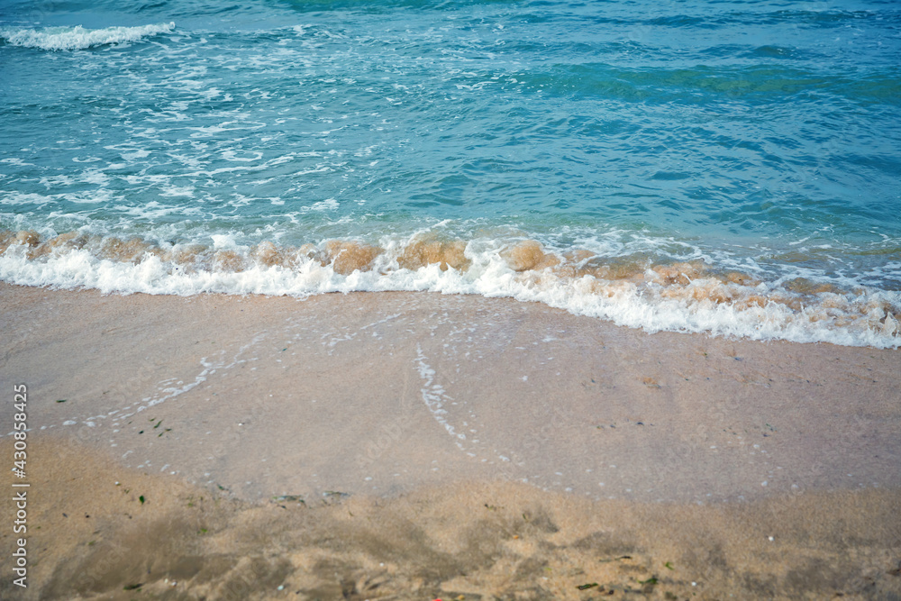 Clean and relaxing sea wave splashes over seashore. Coral beach of tropical paradise. Idyllic seascape for beach wedding or honeymoon. Exotic seaside banner . Caspian Sea sea water over white sand