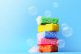 Sponges cleaning on blue background