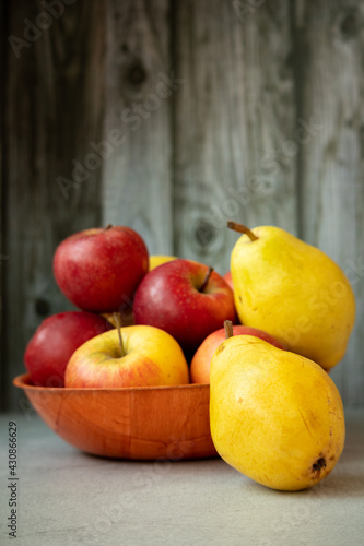 Fresh garden bio healthy, natural fruits, apples and pears in a heap on the plate is a juicy snack