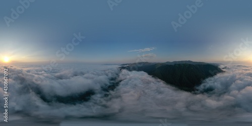 Fototapeta Naklejka Na Ścianę i Meble -  Mountains above the clouds beautiful sunset