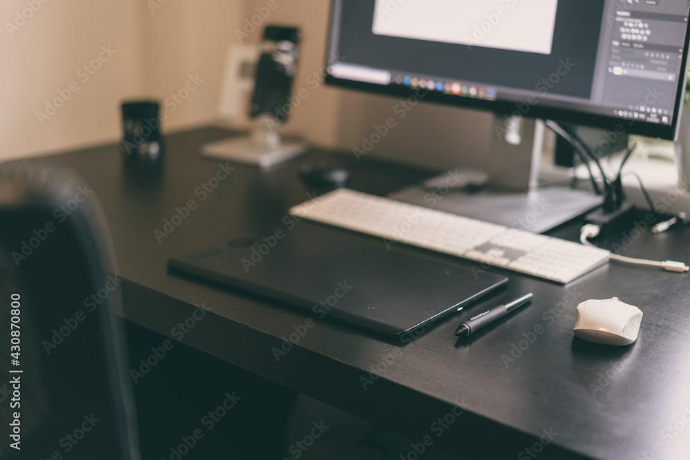 Comfortable workplace for designer, retoucher, photographer or artist with modern computer on table Comfortable workplace for designer, retoucher, photographer or artist with modern computer on table