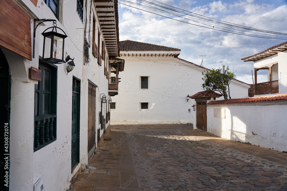   View of a street with Spanish colonial style facades in Villa de Leyva. Colombia.            