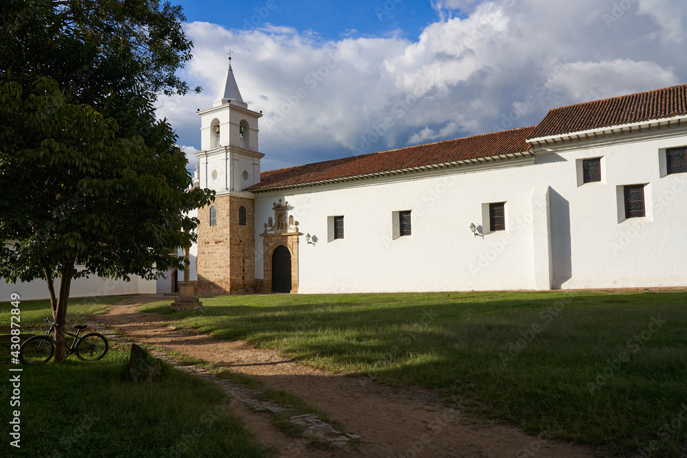 Side of a facade in a church with a bell tower in Villa de Leyva, Colombia.