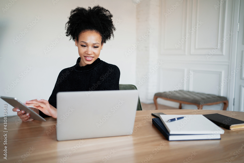 Prints a message on the phone in the messenger. There is a laptop on the table. In the browser, working on a new work project. Prints a message on the phone in the messenger. There is a laptop on the table. In the browser, working on a new work project.