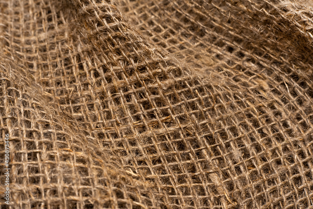 Cloth. The texture of the burlap fabric is close-up. Packaging material. Background Of Burlap Hessian Sacking