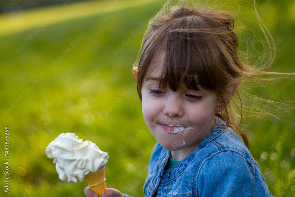 Portrait Of A Cute Girl Eating An Ice Cream Portrait Of A Cute Girl Eating An Ice Cream