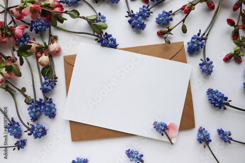 postcard layout. composition of spring flowers and white blank for the text. congratulation. invitation.  © Palanga