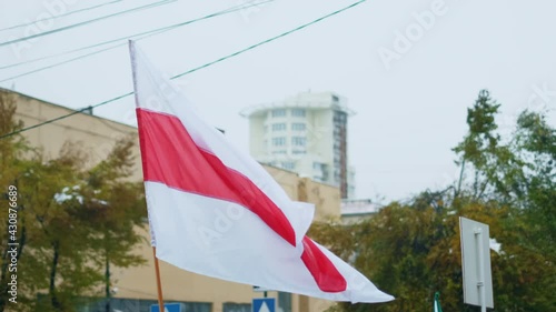 Political protest. White-red-white color flag Belarus wave. Crowded belarusian people. Belorussia strikes out. Belorussian activists. Revolution Byelorussian activism. Fighting rights Byelorussia. photo