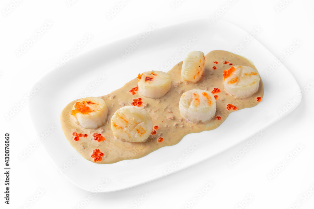 Delicate fragrant scallops in a creamy sauce with red caviar. Seafood dish. Gourmet restaurant menu. White background. Delicate fragrant scallops in a creamy sauce with red caviar. Seafood dish. Gourmet restaurant menu. White background.
