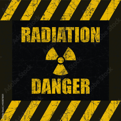 Radiation Danger distressed sign with traditional radiation symbol with three blades.