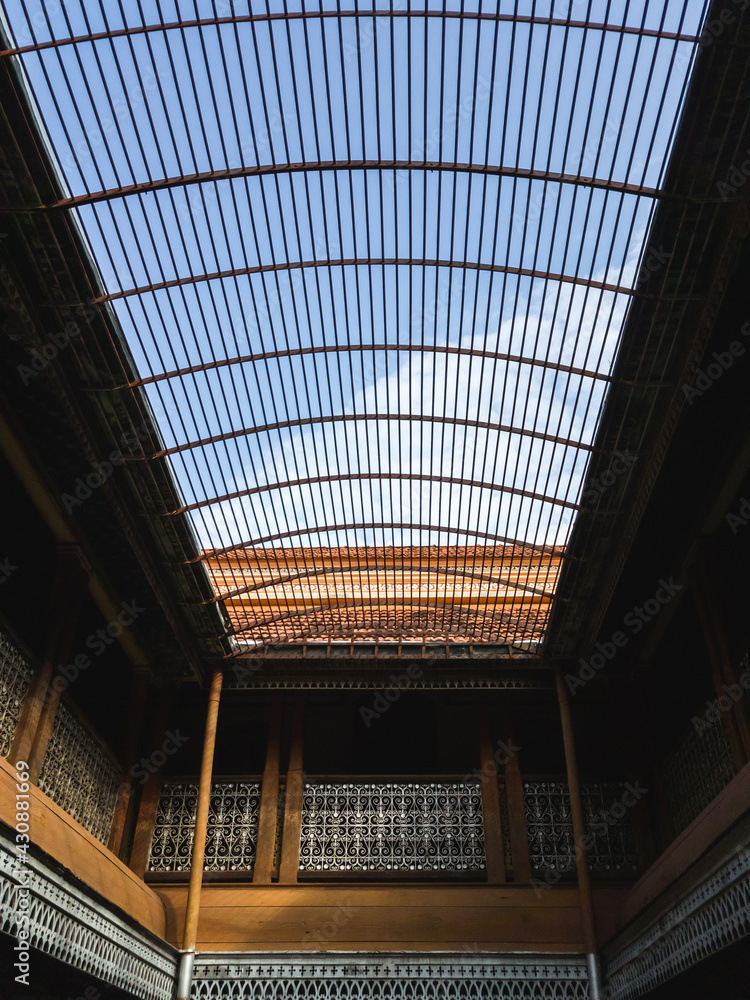 An indoor courtyard with skylight daylighting from an open roof window grille in an ancient mansion in Chettinadu. An indoor courtyard with skylight daylighting from an open roof window grille in an ancient mansion in Chettinadu.