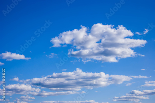 Blue sky with lots of thick clouds. Sky background. Stylized colors to give an entourage.