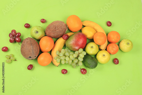 Fresh summer tropical fruits and vegetables on a bright sunny table, citrus mix, detox diet and weight loss concepts, banner, advertising for a store, healthy and natural food, source of vitamin C,