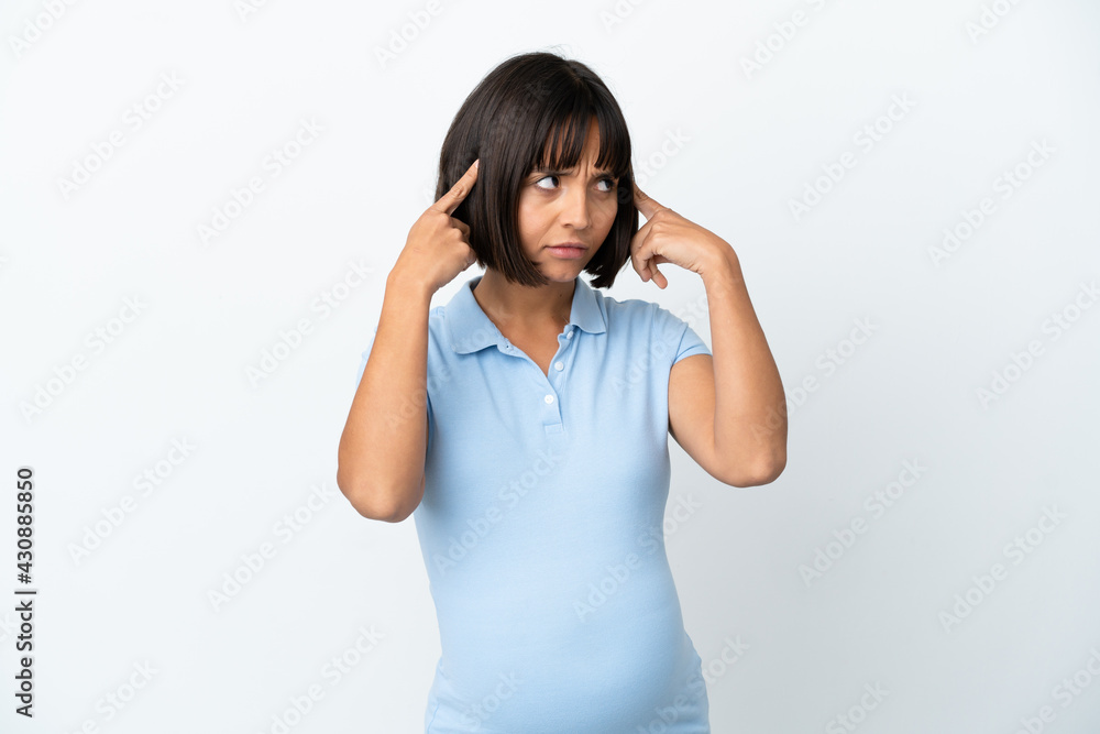 Pregnant woman over isolated white background having doubts and thinking Pregnant woman over isolated white background having doubts and thinking