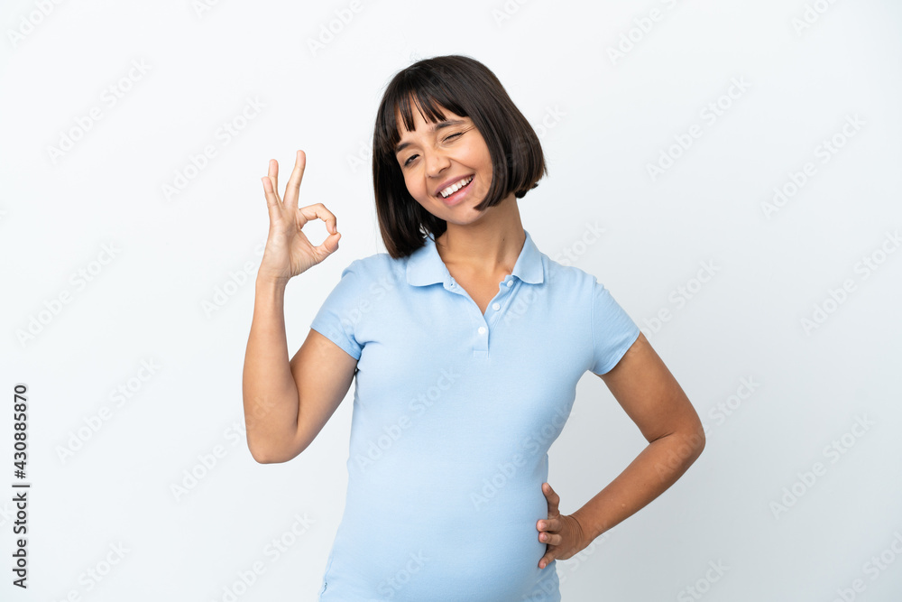 Pregnant woman over isolated white background showing ok sign with fingers Pregnant woman over isolated white background showing ok sign with fingers