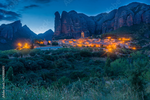 Landscape of the Mallos de Aguero by night famous geological formations with the town of Aguero in the province of Huesca Aragon, Spain.