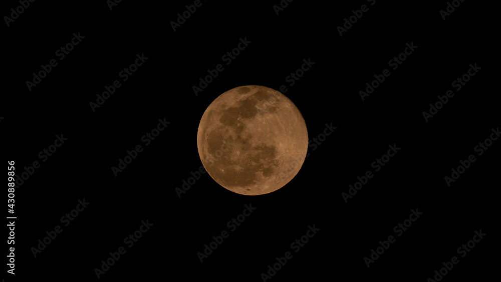 Full moon over dark black sky at night. Selective focus Full moon over dark black sky at night. Selective focus