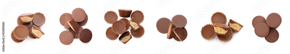 Set with delicious peanut butter cups on white background, top view. Banner design Set with delicious peanut butter cups on white background, top view. Banner design