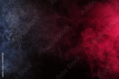 Smoke in white-red light on a black background