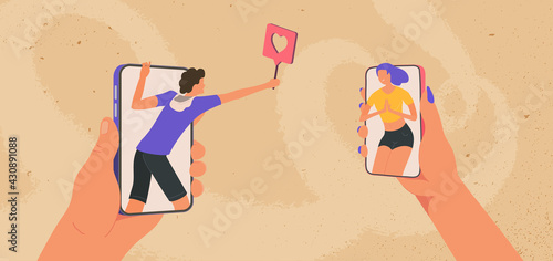 Young man and girl looking at each other on smartphones. Online meeting and flirting. Male giving a like female in social media. Boy telling he love girl by phone.