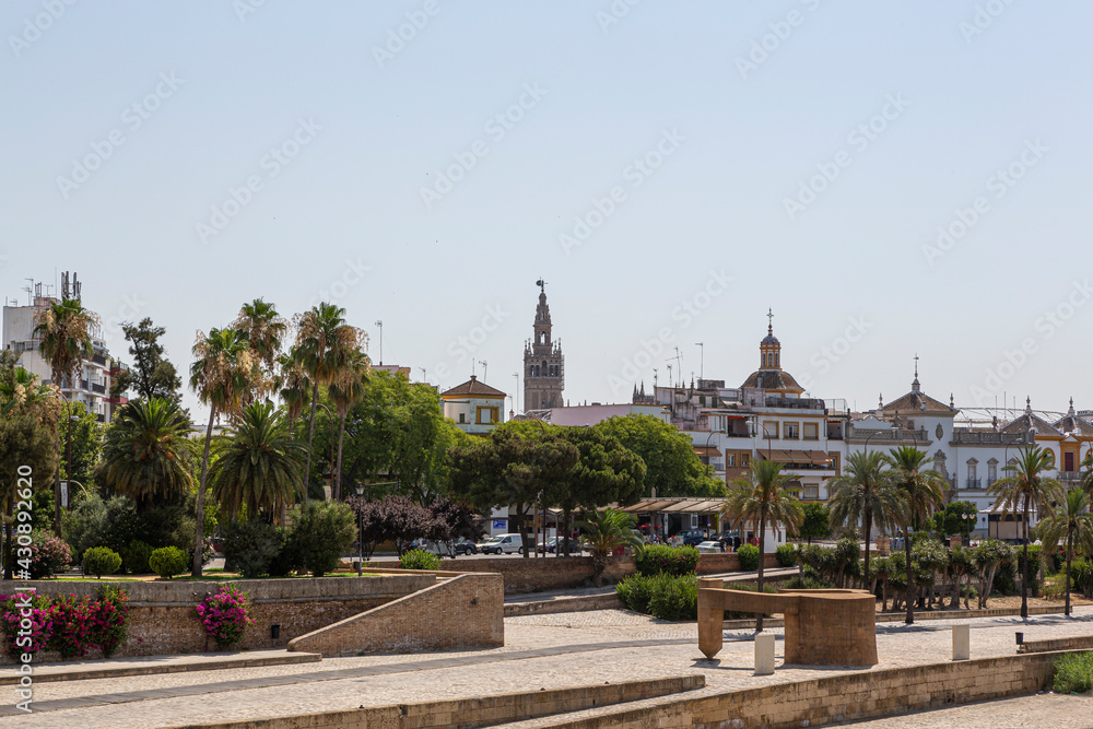 Views from the banks of the Guadalquivir river part of the Giralda of Seville, Spain